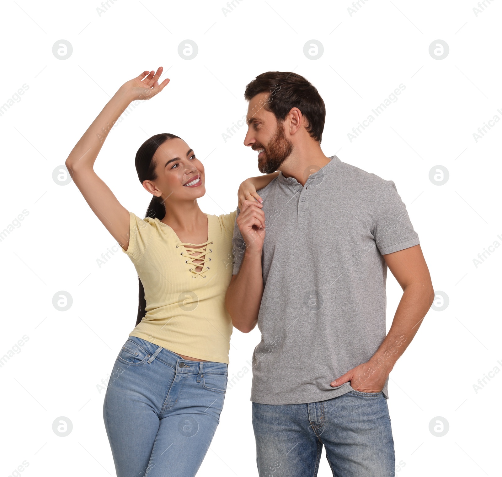Photo of Happy couple dancing together on white background