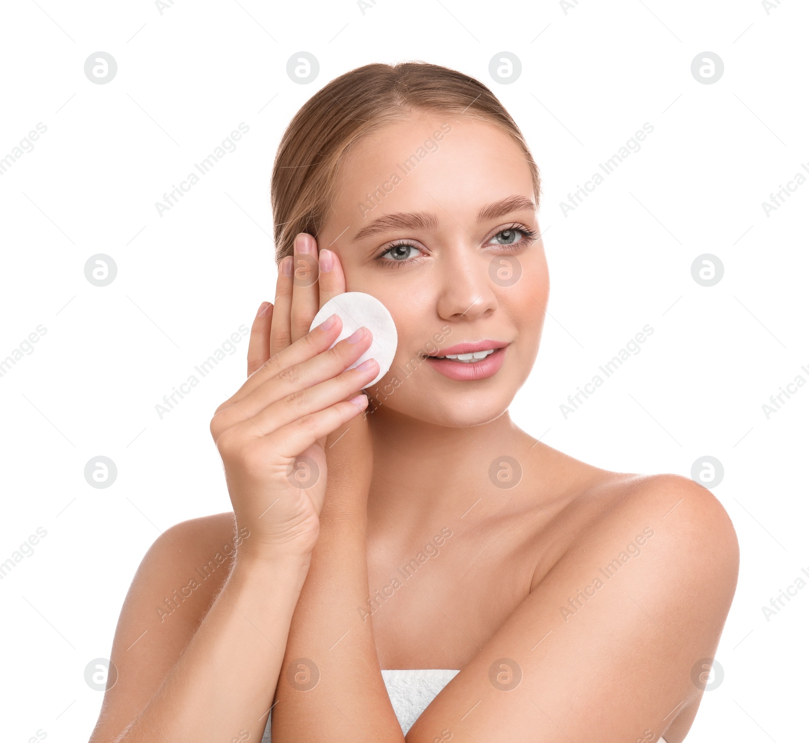 Photo of Beautiful young woman with cotton pad on white background