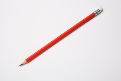 Sharp graphite pencil on white background, top view
