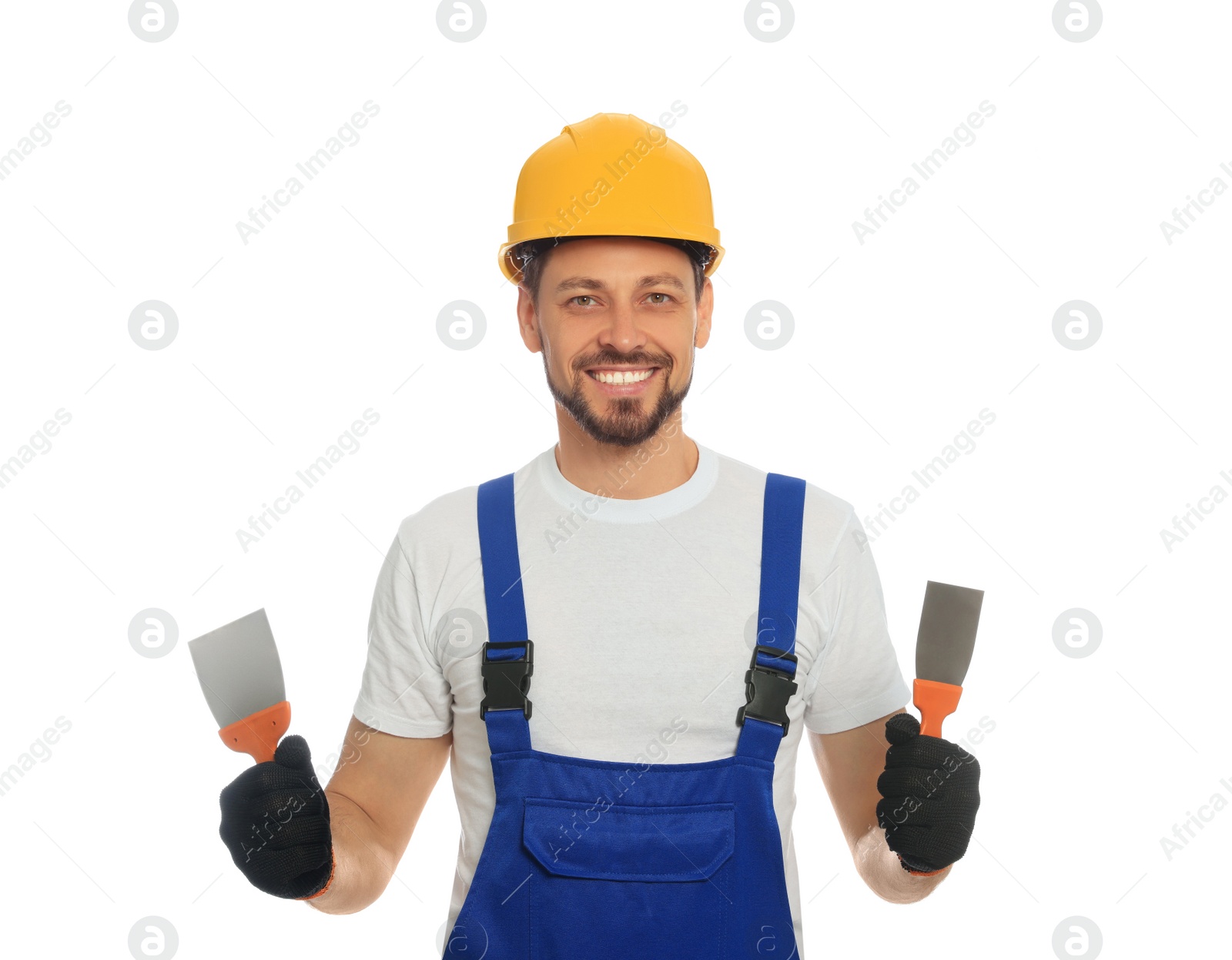 Photo of Professional worker with putty knives in hard hat on white background