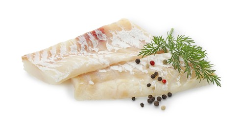 Fresh raw cod fillets with peppercorns and dill isolated on white