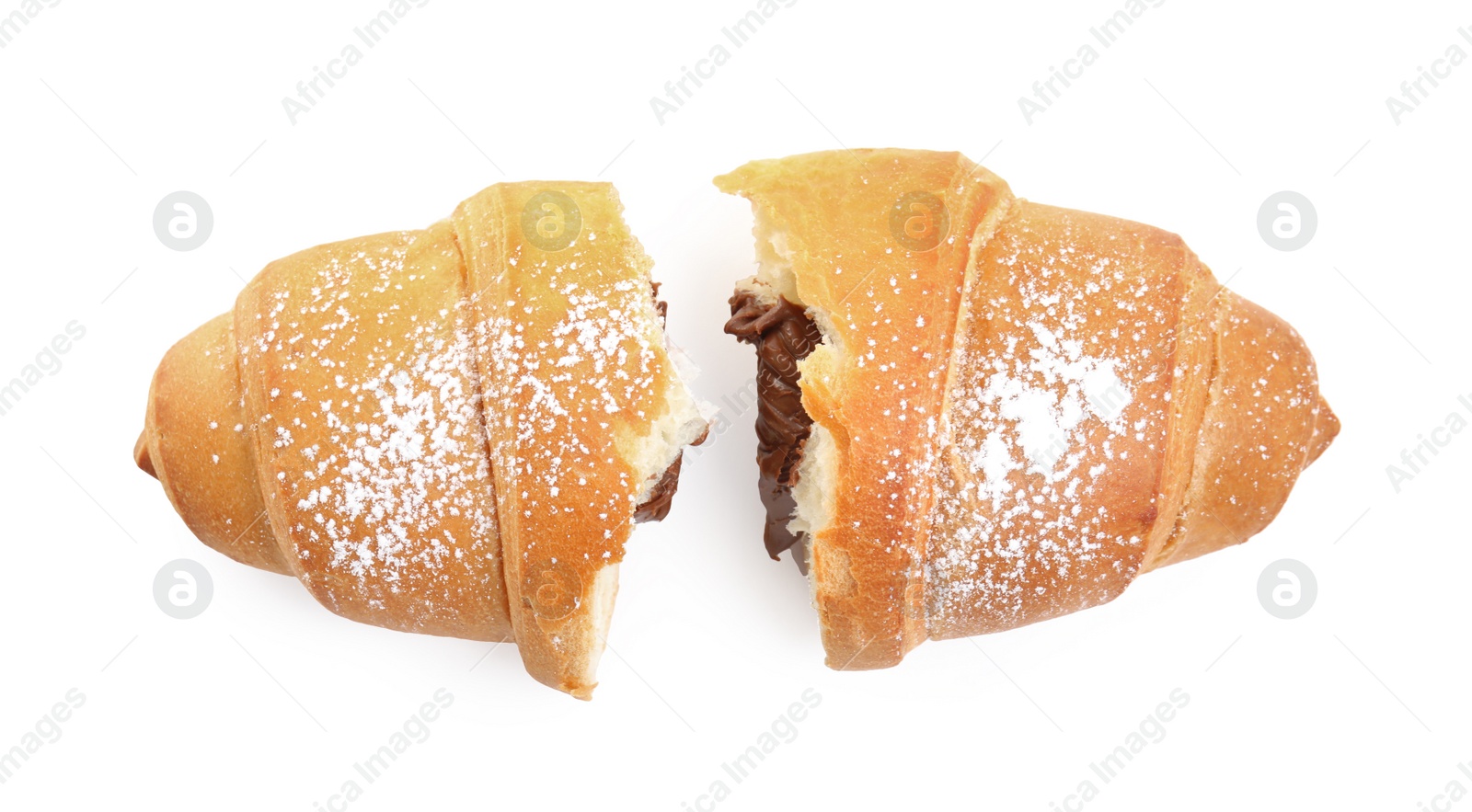 Photo of Halves of tasty croissant with chocolate and sugar powder on white background, top view