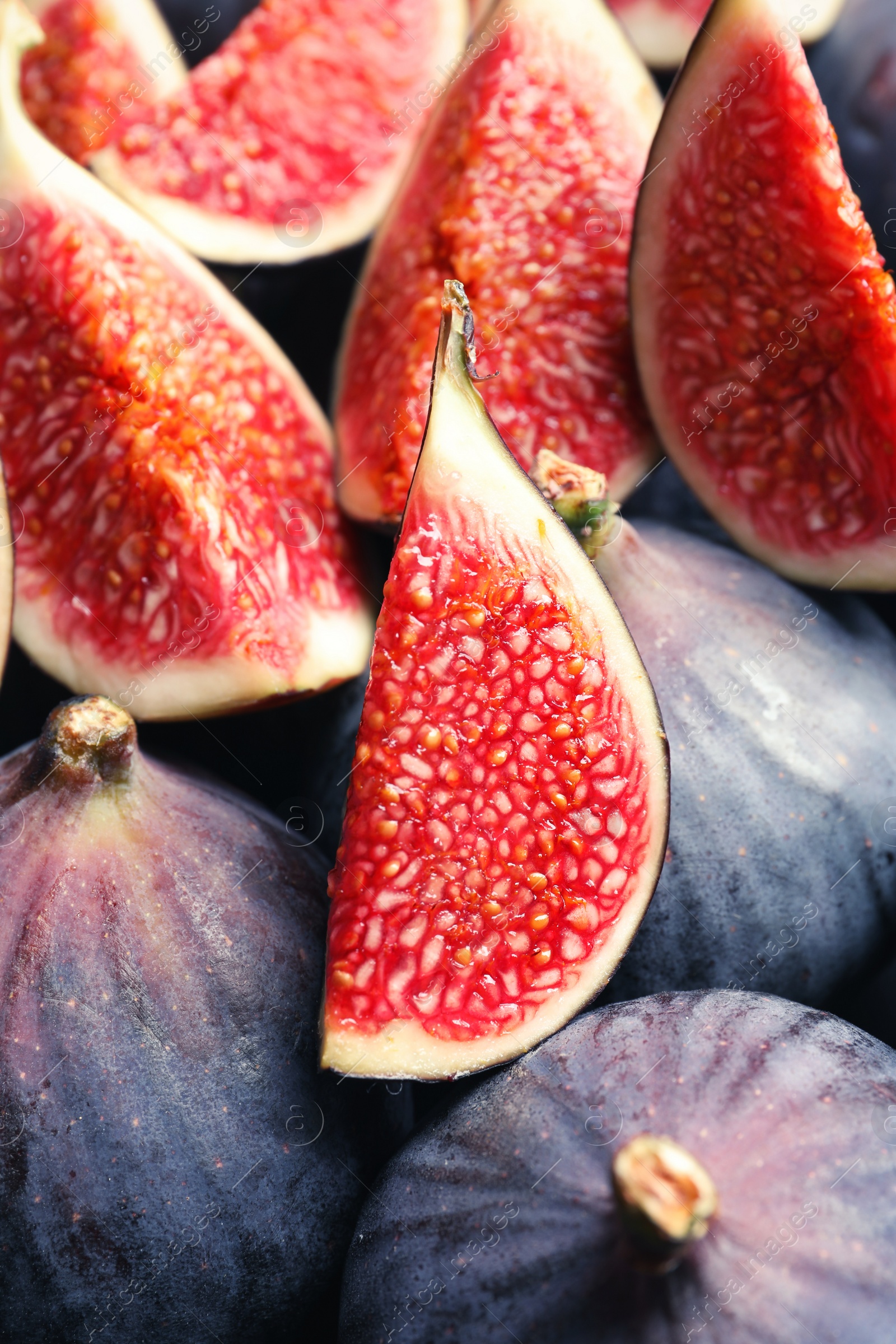 Photo of Fresh ripe fig slices, closeup. Tropical fruit