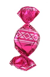 Photo of Candy in bright pink wrapper isolated on white