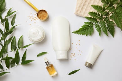 Photo of Flat lay composition with different body care products on white background