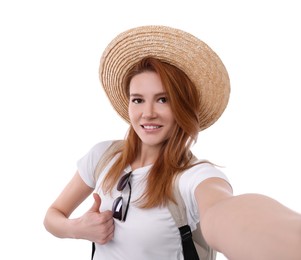 Beautiful woman in straw hat taking selfie on white background