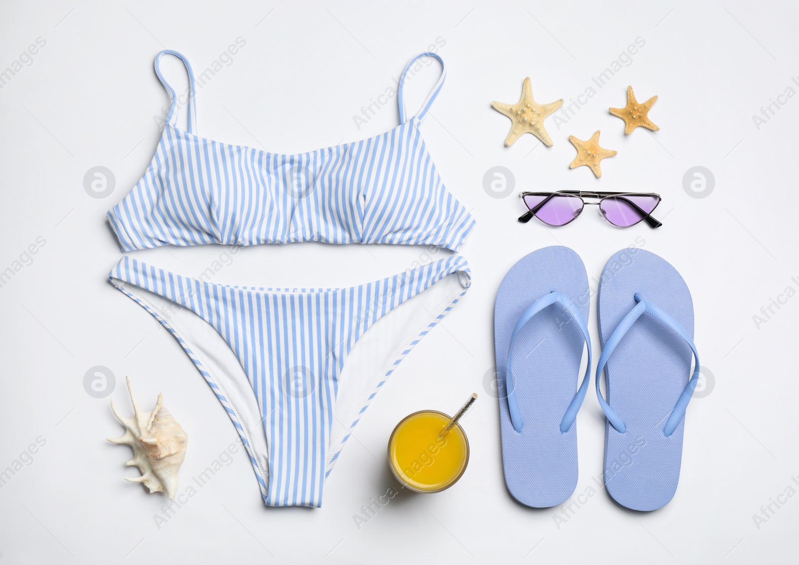 Photo of Flat lay composition with beach objects on white background