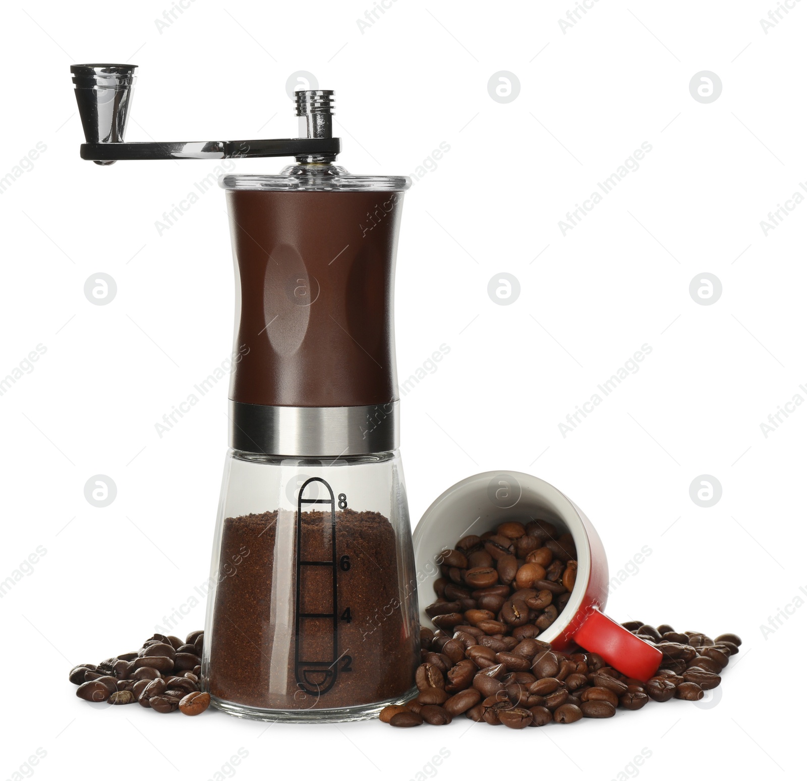 Photo of Modern manual coffee grinder with powder, beans and cup on white background