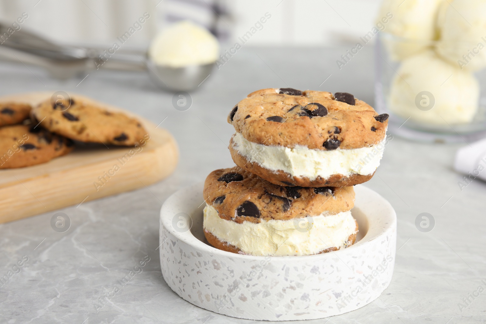 Photo of Sweet delicious ice cream cookie sandwiches on table, space for text