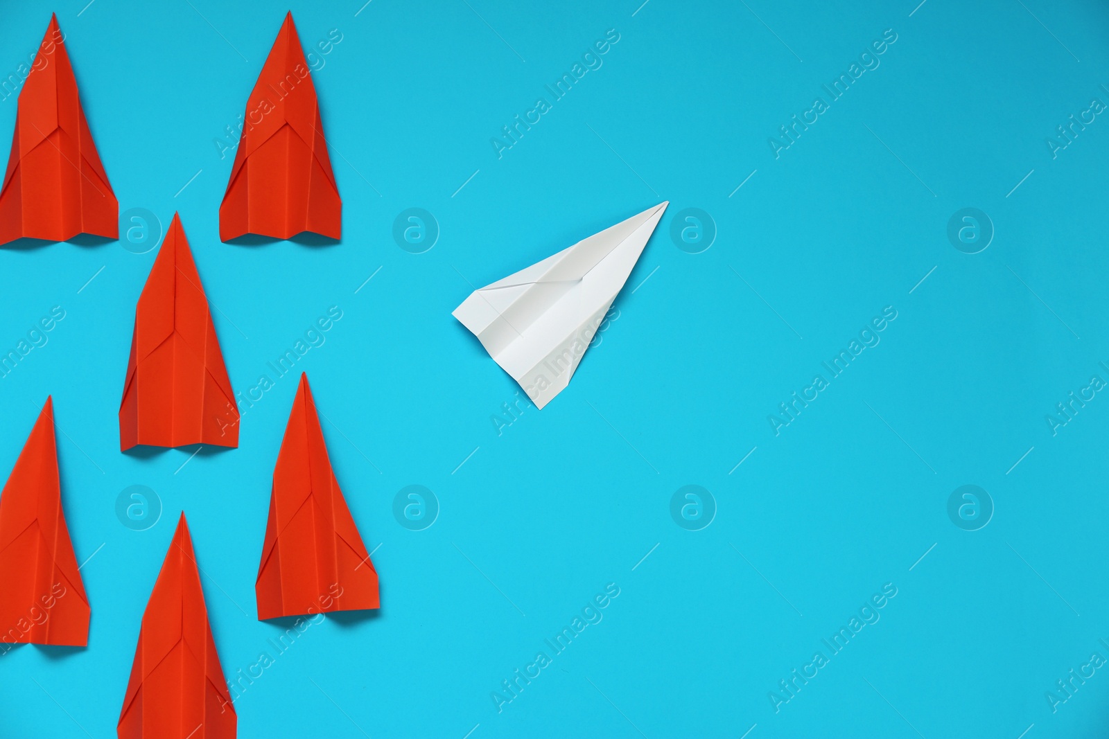 Photo of Flat lay composition with different paper planes on light blue background, space for text