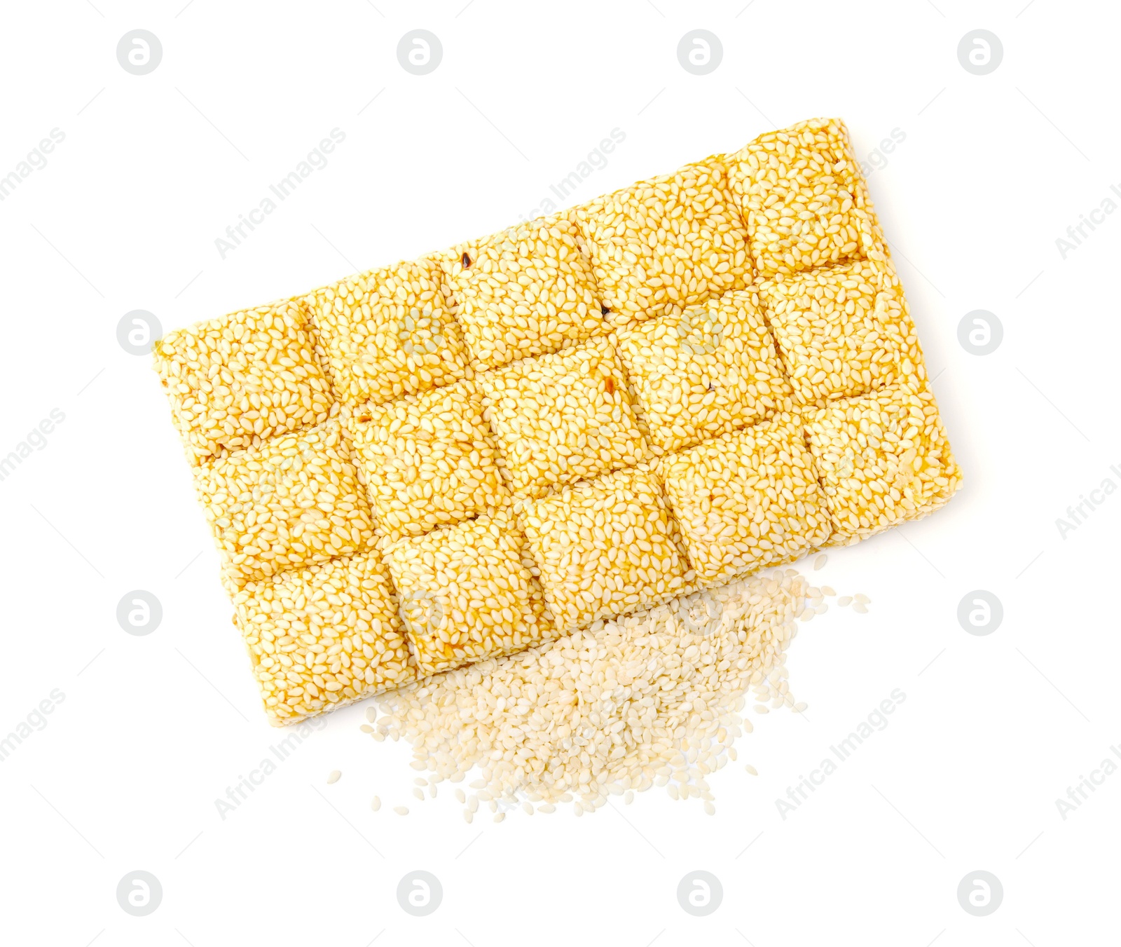 Photo of Delicious sweet kozinaki bar and sesame seeds on white background, top view
