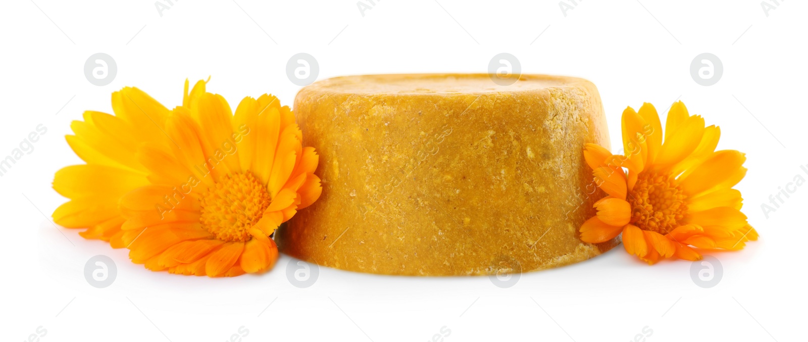 Photo of Yellow solid shampoo bar and flowers on white background. Hair care