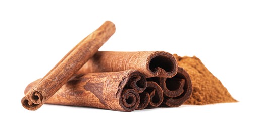 Dry aromatic cinnamon sticks and powder isolated on white