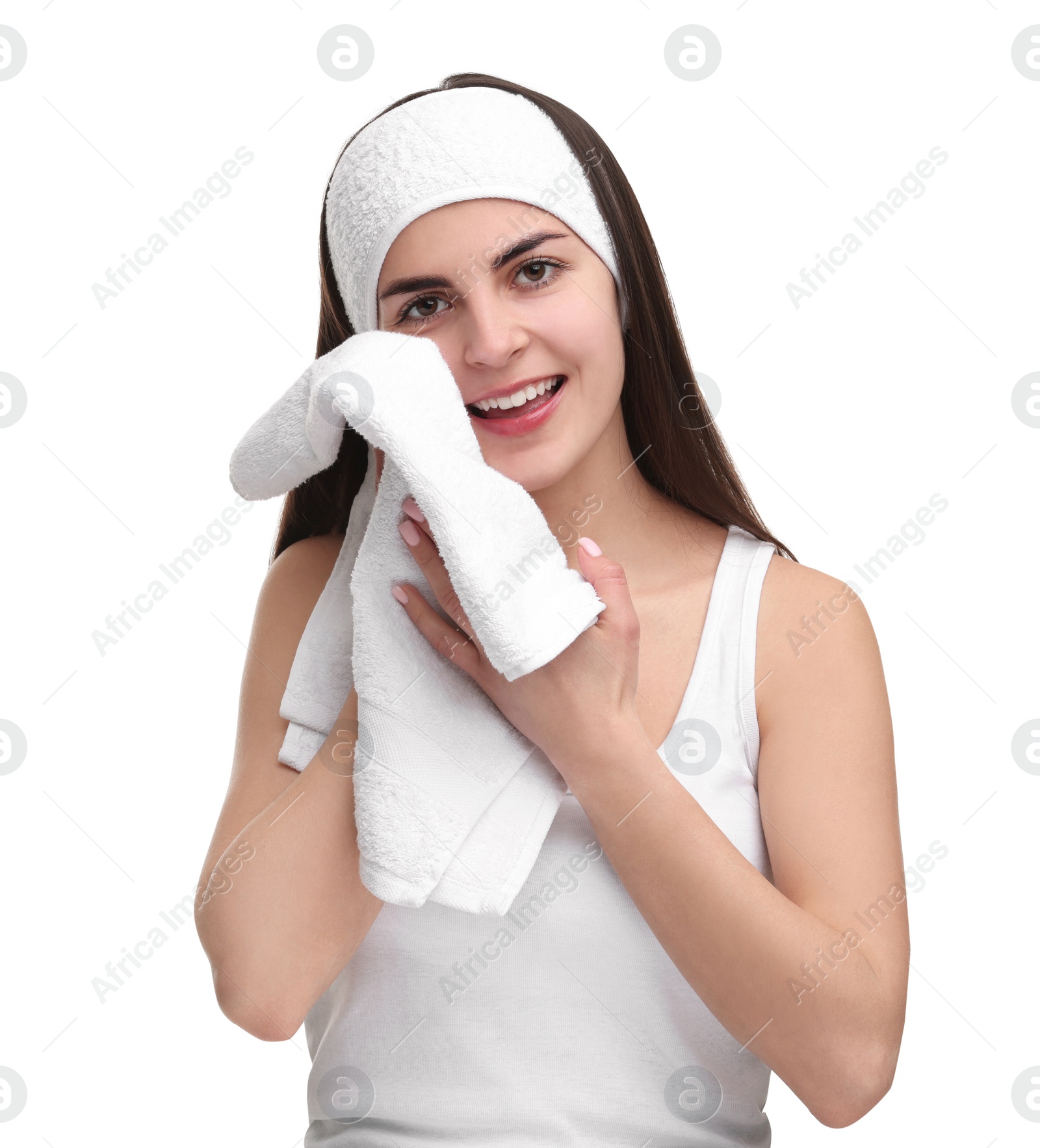 Photo of Washing face. Young woman with headband and towel on white background