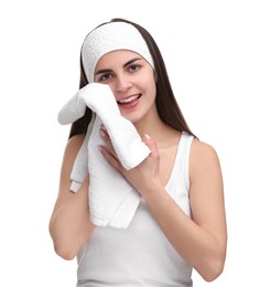 Photo of Washing face. Young woman with headband and towel on white background