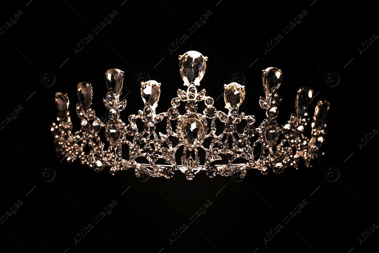 Photo of Beautiful silver tiara with diamonds on black background