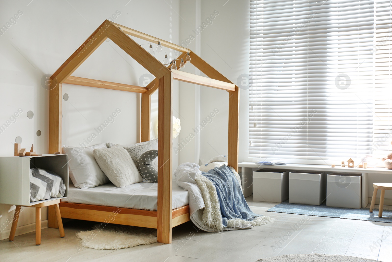 Photo of Cozy child room interior with comfortable bed