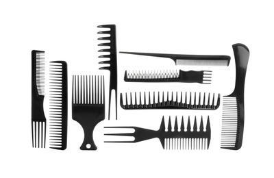 Photo of Set of professional hair combs isolated on white, top view