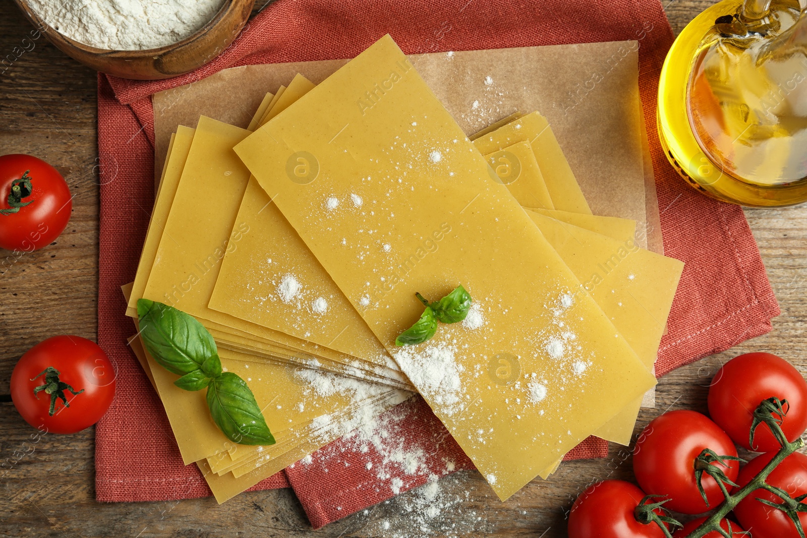 Photo of Flat lay composition with uncooked lasagna sheets on wooden table