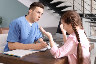 Little girl having appointment at child psychologist office