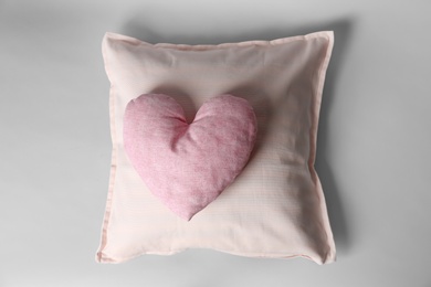 Soft decorative pillows on light background