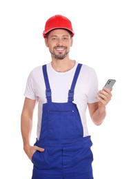 Professional repairman in uniform with phone on white background