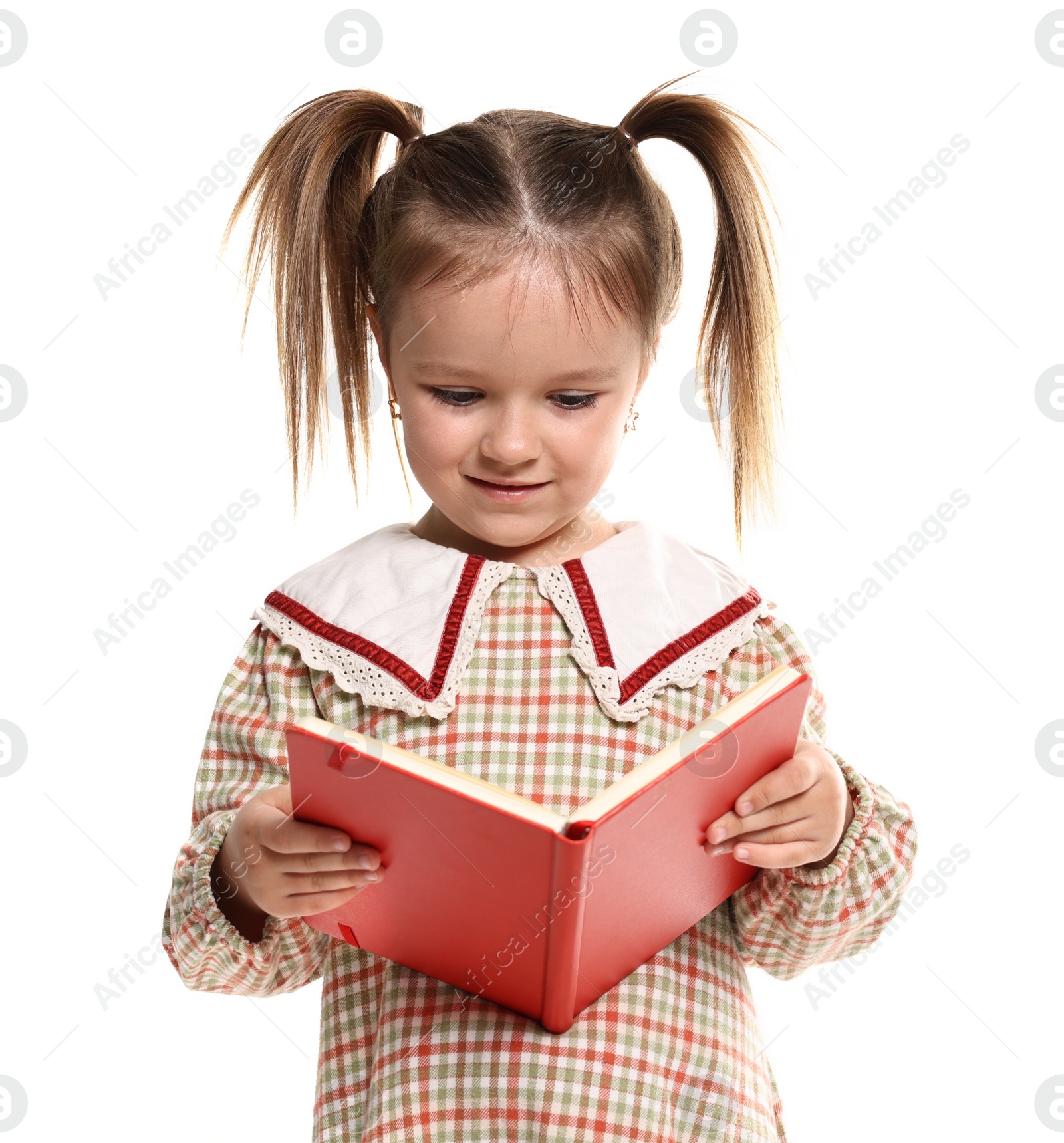 Photo of Cute little girl reading book on white background