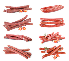 Image of Set with tasty smoked sausages on white background