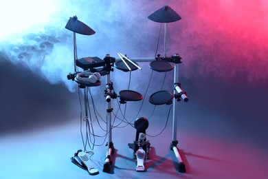Photo of Modern electronic drum kit on grey background, color toned. Musical instrument
