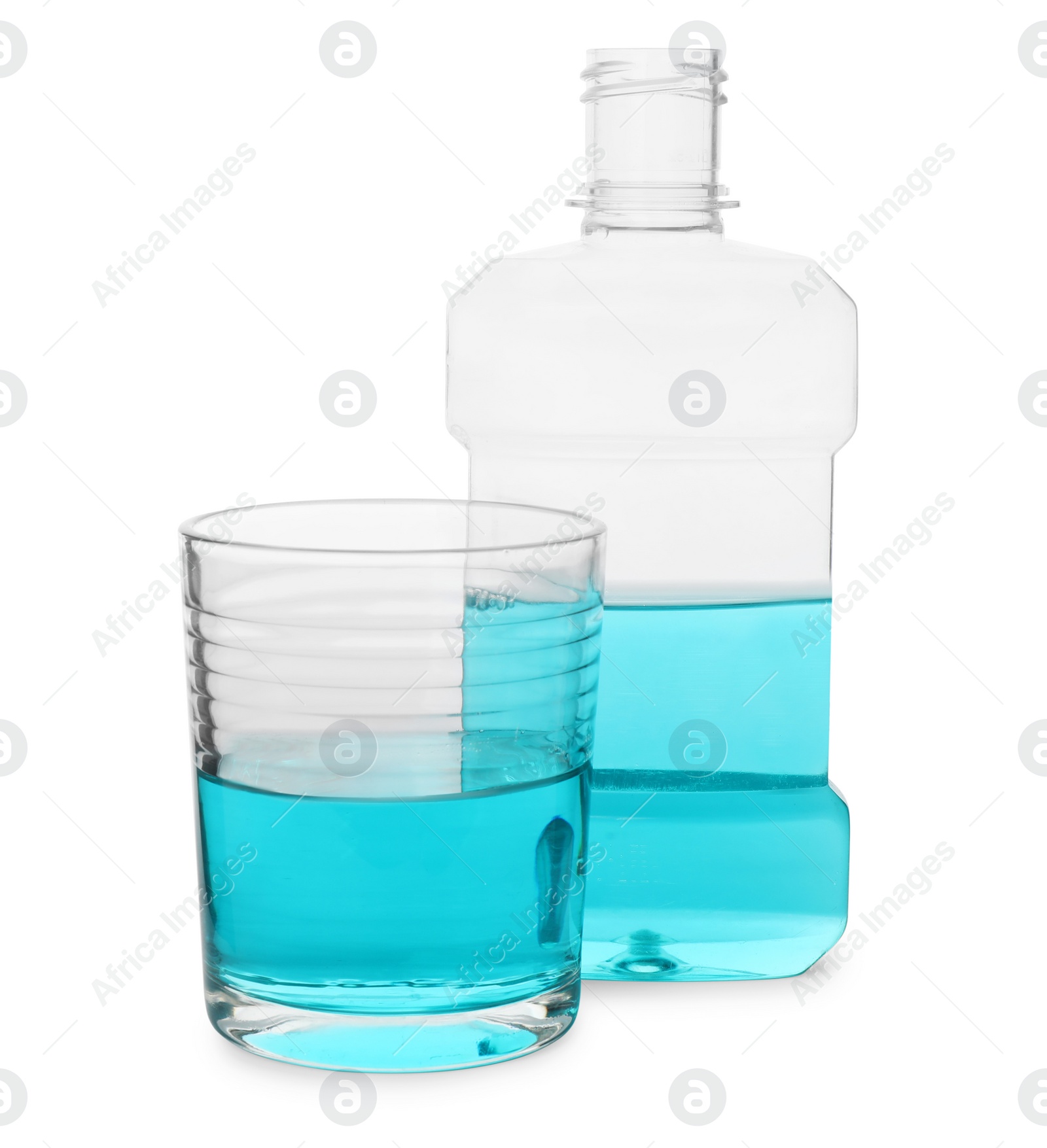 Photo of Bottle and glass with mouthwash on white background. Oral hygiene