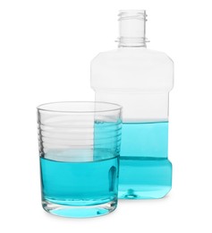 Photo of Bottle and glass with mouthwash on white background. Oral hygiene