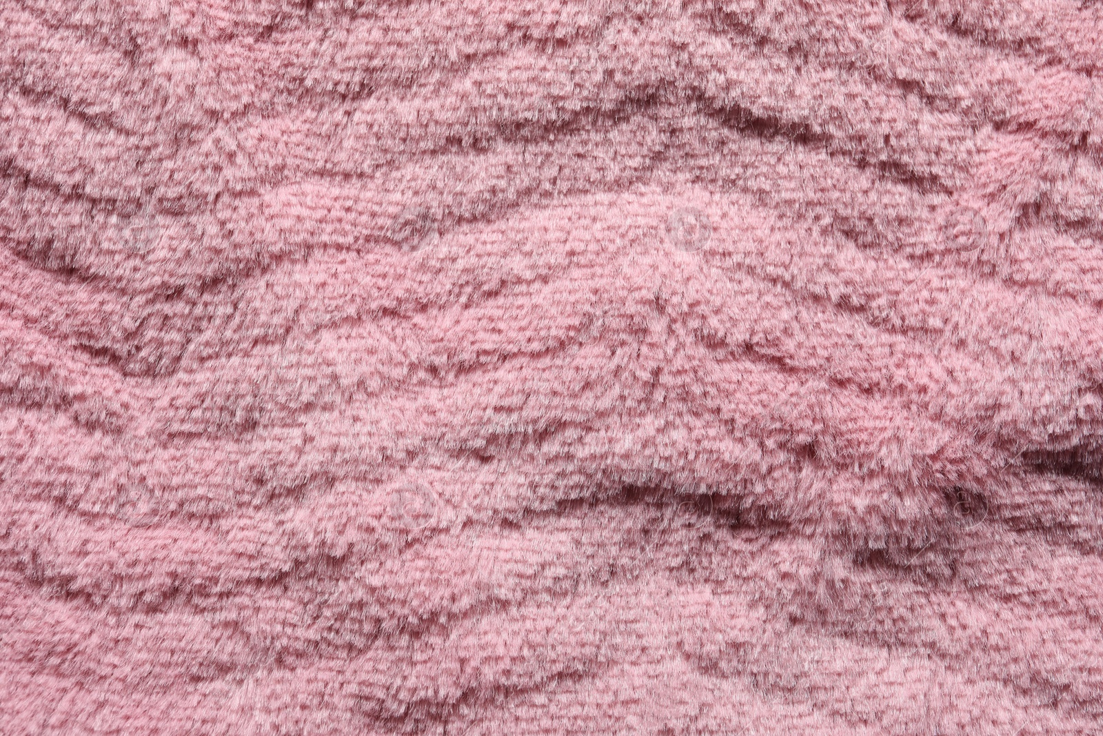 Photo of Texture of pink faux fur as background, top view