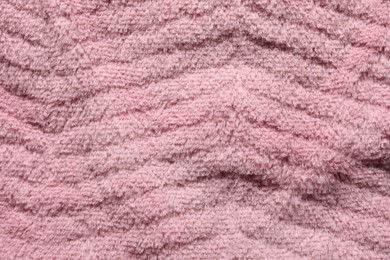 Texture of pink faux fur as background, top view