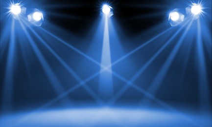 Image of Bright spotlights in darkness. Professional stage equipment