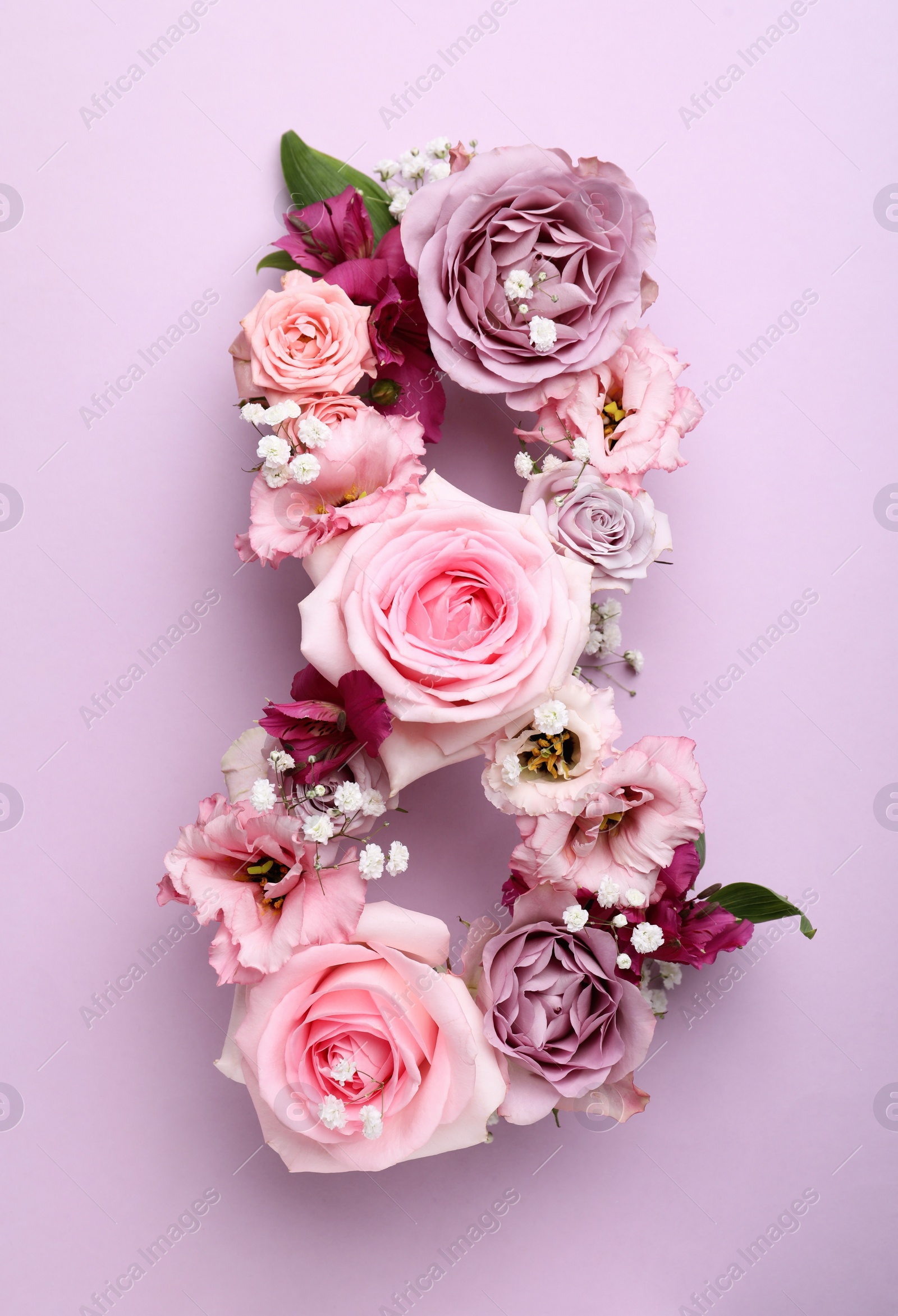 Photo of Number 8 made of beautiful flowers on violet background, flat lay. International Women's day