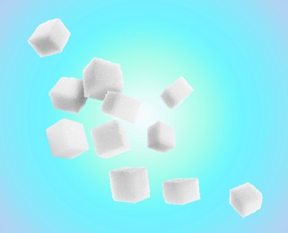 Image of Refined sugar cubes in air on light blue gradient background