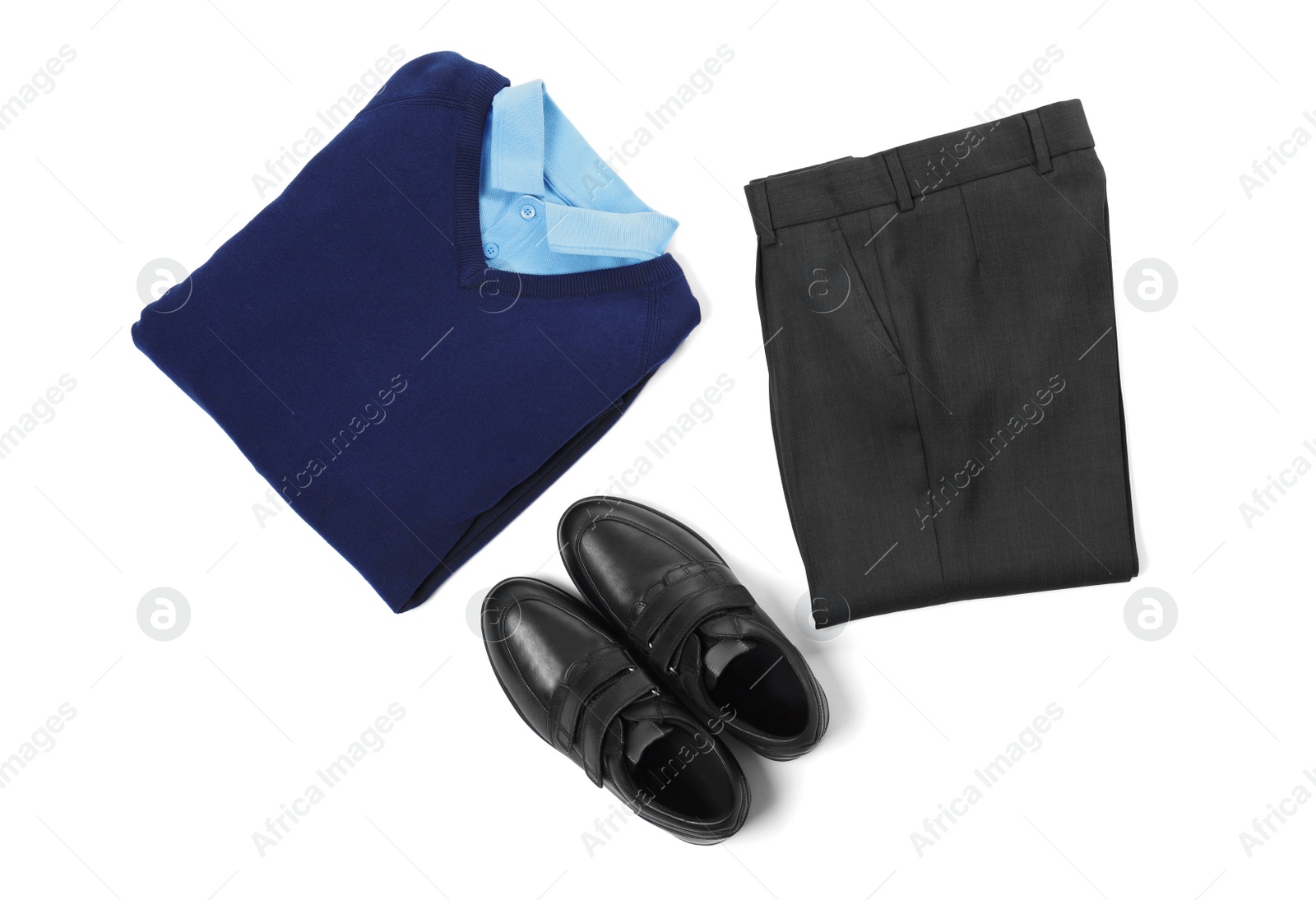 Photo of New stylish school uniform on white background, top view