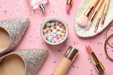 Flat lay composition with decorative cosmetics on color background