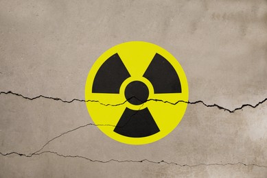 Image of Radioactive sign on old cracked wall. Hazard symbol