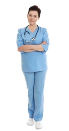 Photo of Full length portrait of female doctor in scrubs isolated on white. Medical staff