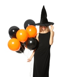 Photo of Beautiful woman wearing witch costume with balloons for Halloween party on white background