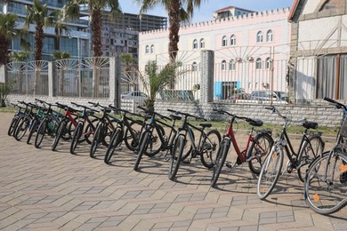 Photo of Parking with different bicycles on city street