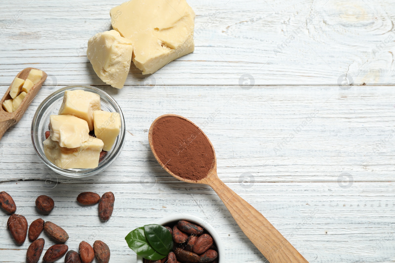 Photo of Flat lay composition with organic cocoa butter on white wooden table. Space for text