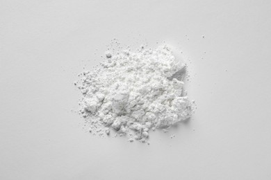 Photo of Heap of calcium carbonate powder on white background, top view