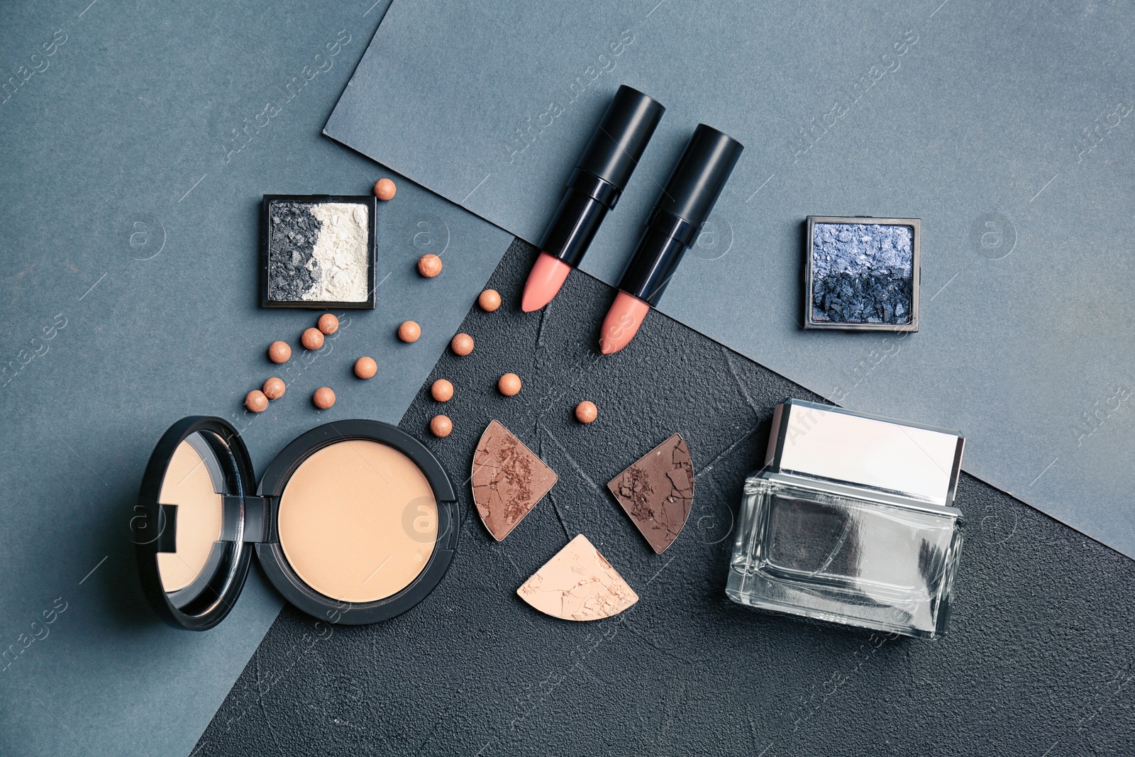 Photo of Flat lay composition with cosmetic products and bottle of perfume on grey background