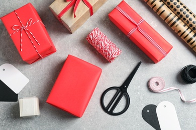 Photo of Flat lay composition with gift boxes on grey background