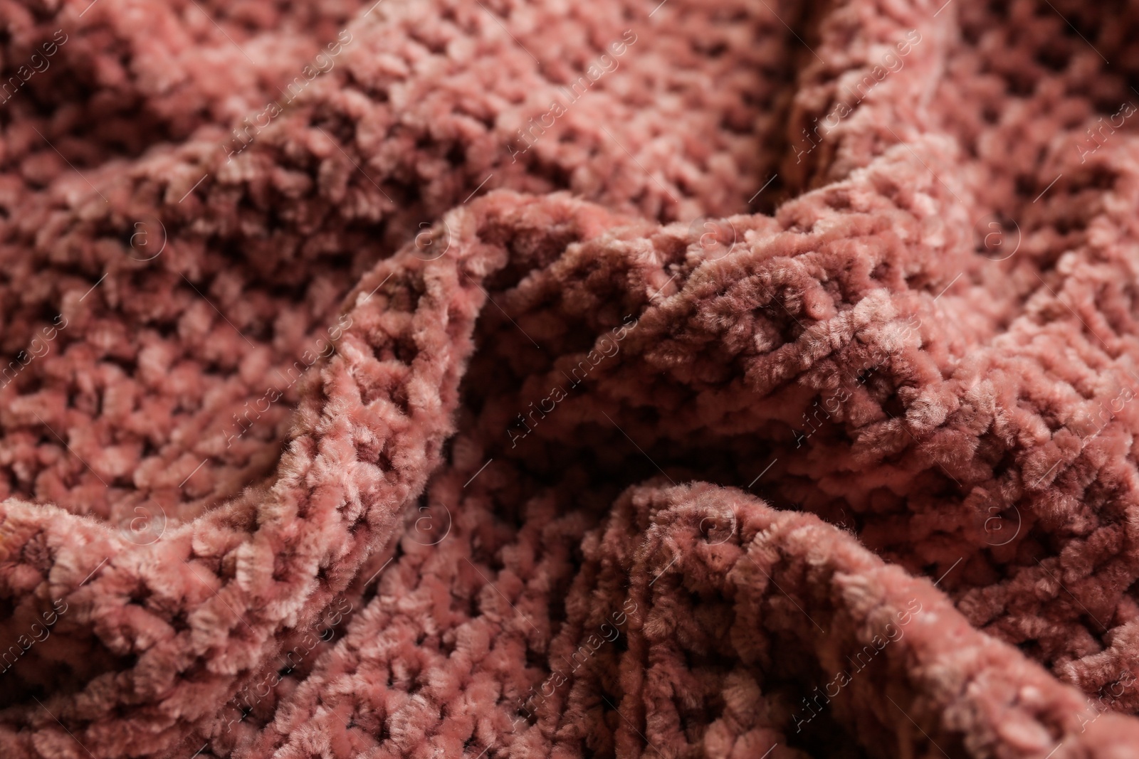 Photo of Beautiful pink knitted fabric as background, closeup