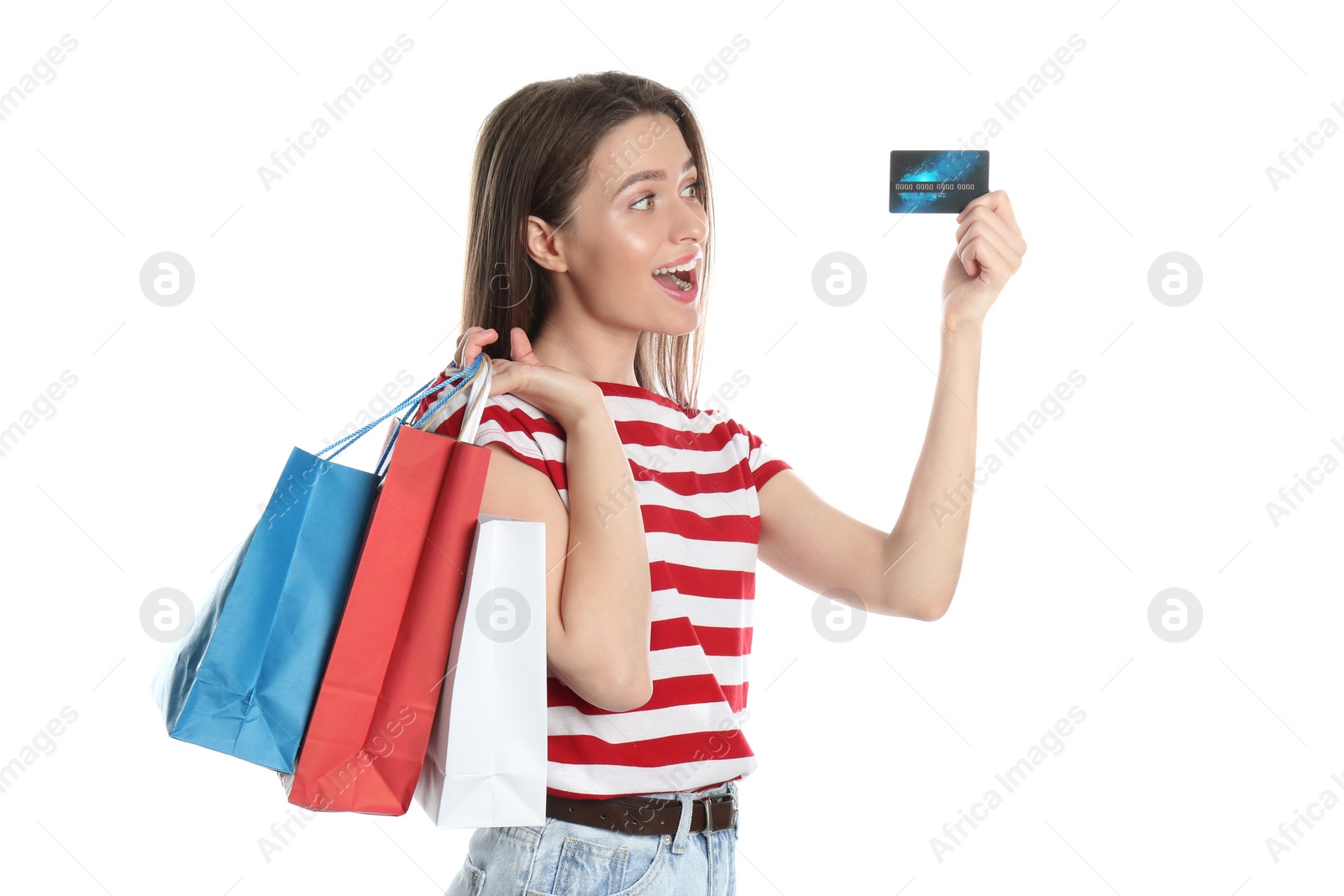 Photo of Young woman with credit card and shopping bags on white background. Spending money