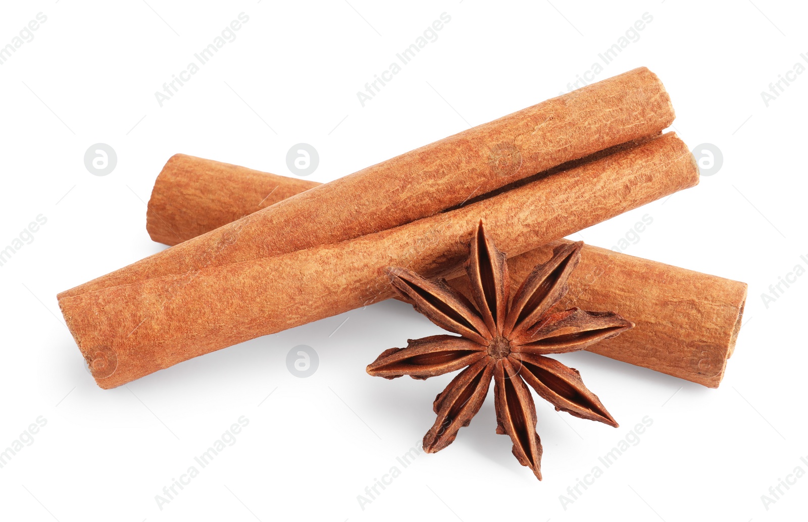 Photo of Aromatic cinnamon sticks and anise star isolated on white