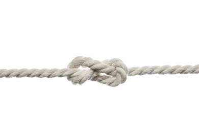 Photo of Cotton rope with knot on white background